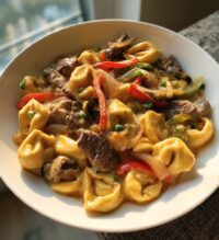 cheesesteak tortellini in rich provolone sauce
