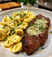 garlic butter steak with cheesy alfredo tortellini